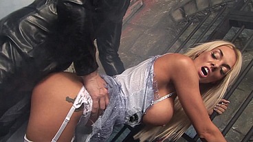 She is practicing walking down the aisle when a masked stranger in a latex body suit stops...