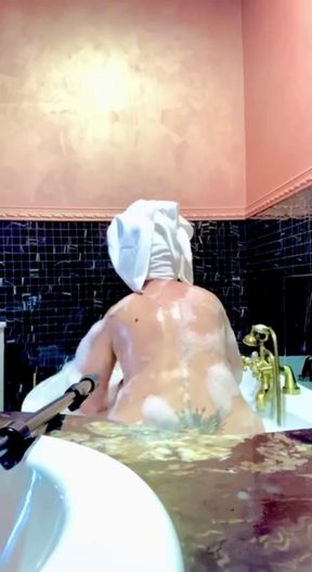Stepmom Takes a Bath and Plays with Her Big Tits