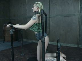 Beautiful blonde white chick shackled to the bars and ducttaped
