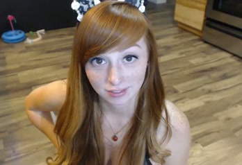 Super hot redhead teen posing seductively in tempting black lingerie