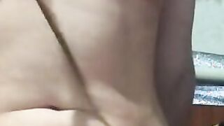 The red-haired women plays with her body. Caressing the breast with a feather. Boobies tight suckers st