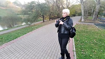 A mature woman with a camera walks about the park, and no one even guesses that she is a famous whore .!. ))