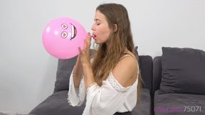 Cute Michelle is blowing up small party balloons (FULLHD quality)