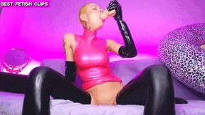 Bald latex slut has fun with the big dildo - First deep in the throat then in the wet pussy