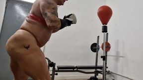 fbb strong woman trying some boxing punches boxing muscular legs biceps angry time