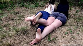 Two pairs of summer young soles of college girls in a public park (Part 4 of 6)