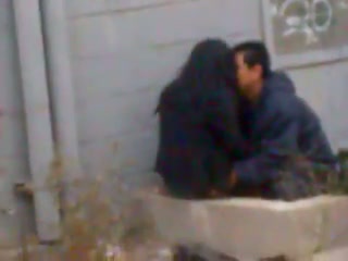 Spying on a horny couple cuddling and fucking outside