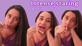 Intense staring and licking a lollipop
