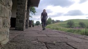 Sissy outdoors on a railway platform