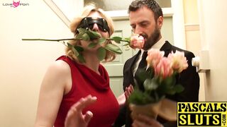 Busty sub has a rose in her mouth and a dick up her pussy
