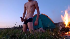 Boy wanks weekly jizm near campfire and tent
