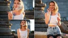 Sasha is smoking 3 reds in a row outdoors