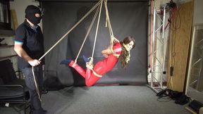 Marie tied gagged and suspended in a shiny nylon Jumpsuit