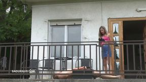 Mistress Tatjana looks far away while he stands on his servant's cock wmv