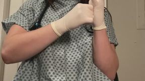 Stethoscope Self Exam and Speculum Play and Pulse Oximeter and White Latex Gloves in Patient Gown