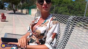 Skinny MILF Leidy De Leon is giving a nice blowjob to a bald guy in the forest