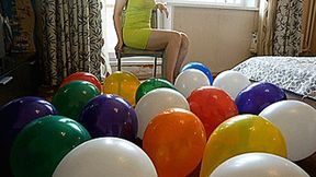 Angie sit pop all balloons on a chair 4K UHD