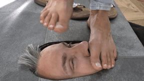 Slave's face under dirty flip flops and feet (small version)