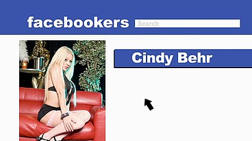 Cindy Behr Looks Into The Camera As She Rubs Cum On Her Face With A Cock