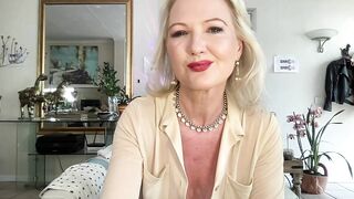 Older blonde caresses her twat on camera