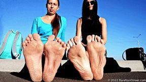 Anastasia and Kristina with huge feet barefoot on an asphalt field (Part 2 of 4) #20220420
