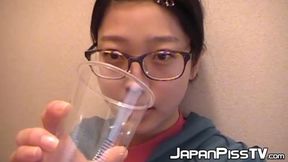 Tiny Asian Damsel pisses on Toilet then Drinks from Cup
