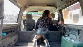 girl in leather pants cleaning her van