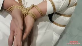 East Asian Erotic Bondage: Gagged Brunette Wrapped