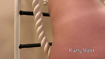 Skinny russian babe Katty West makes exercises on the wall-mounted ladder