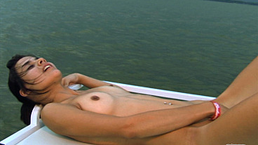 Petite brunette pleasure herself on a boat