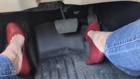 Fifi pedal pumping in red high heels and blue jeans