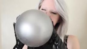 Latex Babe Blows and Plays With Balloons