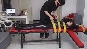 Asian Latex Catsuit Table Tape Bondage