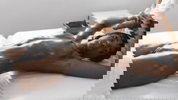 Glistening Black Statue of Perfection on The Massage Table