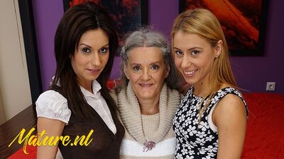 Kinky grandma and two teen chicks are having lesbian threesome