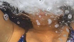 The invisible dunks me in the sea as I wash my hair