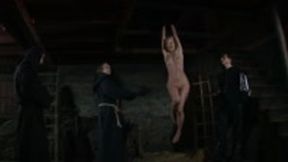 Blonde wench is stripped naked and pulled up to the ceiling for interrogation
