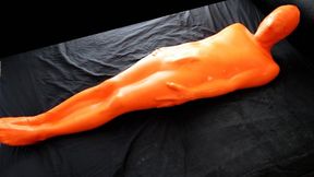 Trapped in a skintight orange latex sack