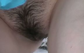 Lovely hairy pussy of a white girl in the public toilet room