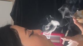 HANDY REACHES OUT AND BLOWS OUT SMOKE