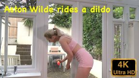 Aston Wilde rides a dildo