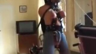 Angela dangles from the ceiling and whipped