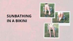 Sunbathing in a bikini