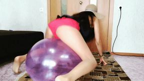 An elastic balloon pops under an appetizing ass