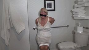 MILF bound and gagged in her full slip and girdle