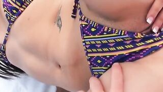 Sun bathing sexy slides her bikini bottoms to the side