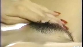 Thai mistress unfurls her bushy pussy&#x270C; for a solo bedroom romp on the sheets'