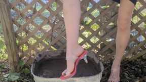 Fifi loses a brand new pair of sexy clear heels with red insoles into calf deep mud
