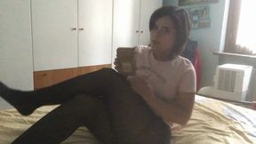 I ignore you wearing a pair of pantyhose while looking at my cell phone cross-legged