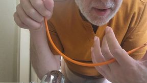 stuffguy #11 was going to simply jerk off but then decided to take a piss and use the catheter to get off.